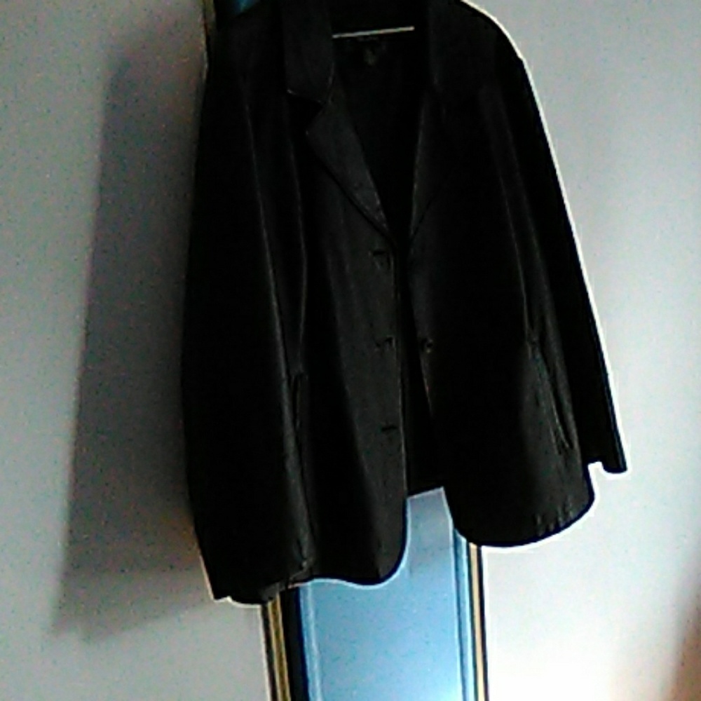 Black slightly worn leather lined jacket